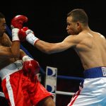 Fotografía de archivo donde aparece Eric Morel (d) mientras ataca a Jesús Rojas durante la pelea por el Campeonato Nabo Junior Gallo (115 libras) en el Coliseo Mario Quijote Morales en Guaynabo Puerto Rico. EFE/Sol Lopez.