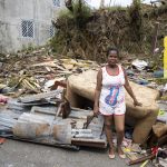 La ciudadana Belkis permanece parada junto a los restos de su casa, que resultó completamente destruida tras el paso del huracán Fiona, hoy, en la carretera Miches - El Seibo (República Dominicana). EFE/ Orlando Barría