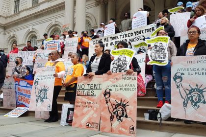 Dozens of immigrants and activists hold banners calling for housing instead of tents for undocumented immigrants, during a protest on the steps of the New York City Hall, USA, 13 October 2022. Latino immigrants, politicians and activists made their voices heard this Thursday in New York in defense of the thousands of immigrants who are arriving in New York, to demand that they be placed in safe housing and not in giant tents as announced by the Mayor's Office. EFE/ Jorge Fuentelsaz