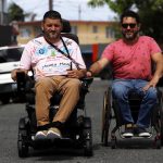 Rubén Rodríguez (i) y Ángel Gabriel Román posan durante un recorrido por una calle el 9 de febrero de 2022, en San Juan (Puerto Rico). EFE/ Thais Llorca