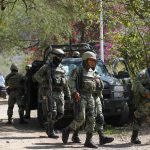 Soldados del ejército mexicano hacen presencia en la zona en la que se registró un ataque en contra de miembros de la fiscalía de Jalisco el 11 de julio de 2023, hoy, en el municipio de Tlajomulco (México). EFE/ Francisco Guasco