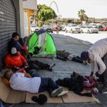 Presuntos consumidores de droga permanecen en una calle el 26 de julio de 2023, en Tijuana (México).  EFE/ Joebeth Terriquez