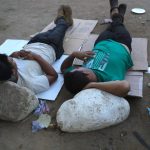 Migrantes venezolanos descansan en la ciudad de Danlí (Honduras). Fotografía de archivo. EFE/Gustavo Amador